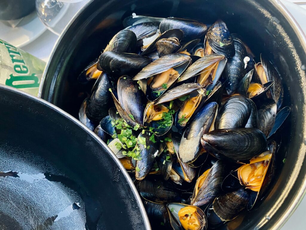 Bouchot Mussels, a staple in Charente-Maritime seafood cuisine, served at Chateau Charente's farm-to-table menus.